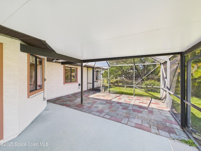view of patio / terrace featuring glass enclosure