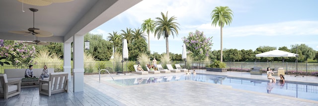 pool with a patio, fence, and a ceiling fan