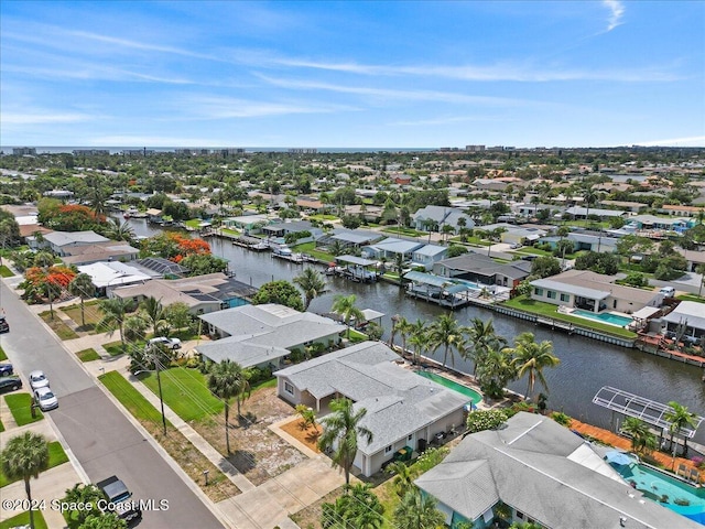 drone / aerial view featuring a water view and a residential view