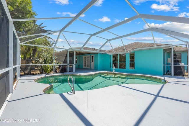 619 Dinner St NE, Palm Bay, FL 32907 - pool with glass enclosure and a patio