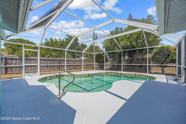 619 Dinner St NE, Palm Bay, FL 32907 - view of swimming pool with a patio, a fenced in pool, a fenced backyard, and glass enclosure