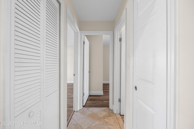 619 Dinner St NE, Palm Bay, FL 32907 - hall with baseboards and light tile patterned flooring