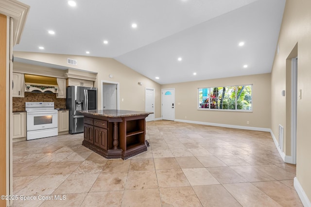619 Dinner St NE, Palm Bay, FL 32907 - kitchen with white electric stove, stainless steel refrigerator with ice dispenser, visible vents, a kitchen island, and lofted ceiling