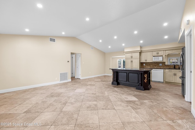 619 Dinner St NE, Palm Bay, FL 32907 - kitchen with visible vents, cream cabinets, lofted ceiling, and white appliances