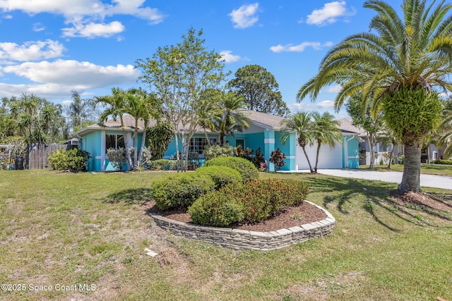619 Dinner St NE, Palm Bay, FL 32907 - ranch-style house featuring a front lawn, driveway, and an attached garage