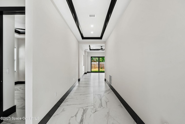 hall with baseboards, marble finish floor, and visible vents