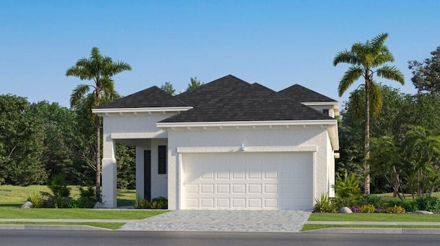 view of front of house with stucco siding, roof with shingles, decorative driveway, and a garage
