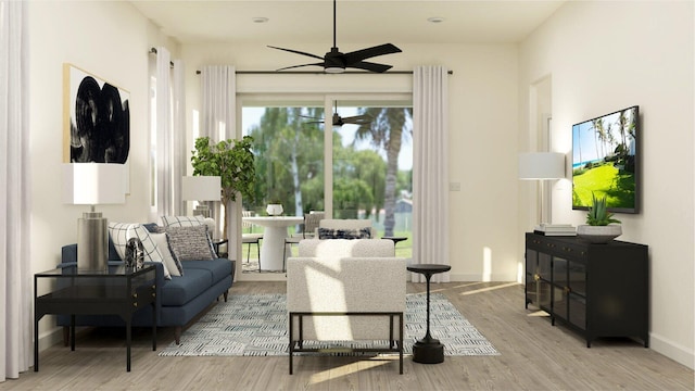 living area with ceiling fan, baseboards, and wood finished floors