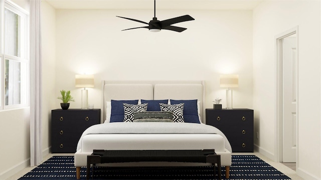 carpeted bedroom featuring baseboards and a ceiling fan