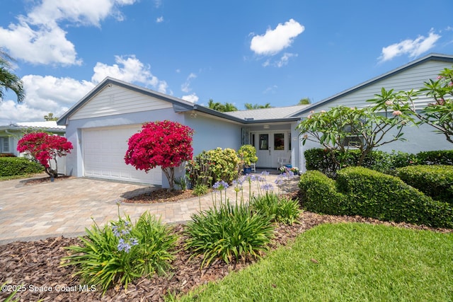 190 Harwood Ave, Satellite Beach, FL 32937 - single story home featuring an attached garage, decorative driveway, and stucco siding