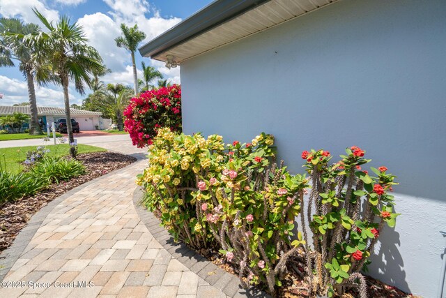 190 Harwood Ave, Satellite Beach, FL 32937 - view of side of home featuring stucco siding
