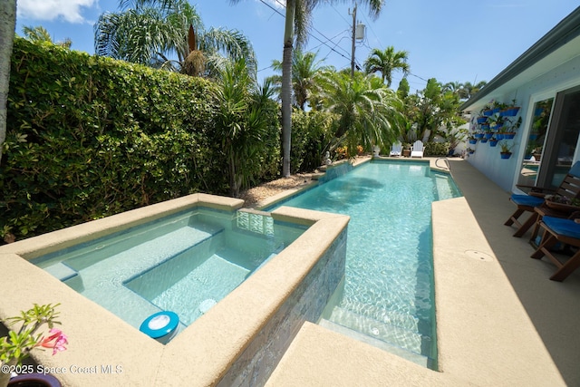 190 Harwood Ave, Satellite Beach, FL 32937 - view of swimming pool featuring a pool with connected hot tub