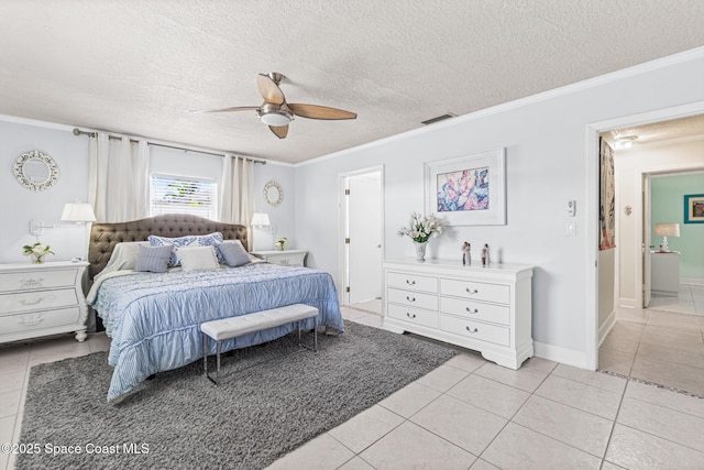 190 Harwood Ave, Satellite Beach, FL 32937 - bedroom featuring light tile patterned flooring, crown molding, a textured ceiling, and ceiling fan