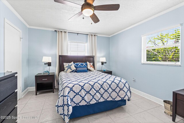 190 Harwood Ave, Satellite Beach, FL 32937 - bedroom with a textured ceiling, ornamental molding, light tile patterned flooring, baseboards, and ceiling fan