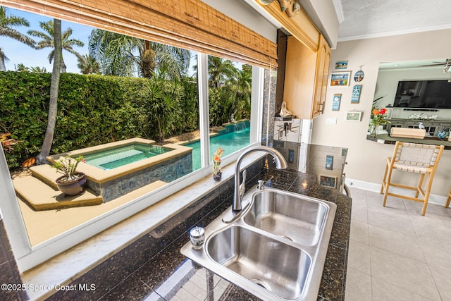 190 Harwood Ave, Satellite Beach, FL 32937 - detailed view of a sink, ornamental molding, and baseboards