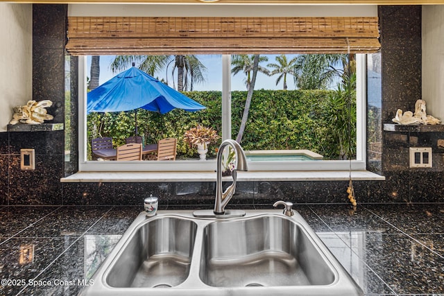 190 Harwood Ave, Satellite Beach, FL 32937 - detailed view of a sink, tile countertops, and backsplash