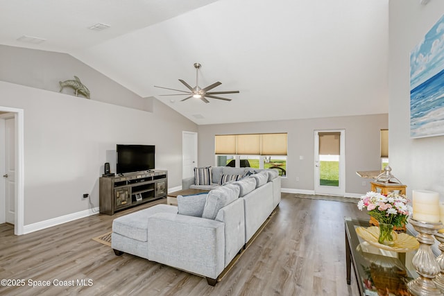 4569 Lady Hawk Way, Melbourne, FL 32904 - living area featuring a ceiling fan, light wood finished floors, high vaulted ceiling, and baseboards