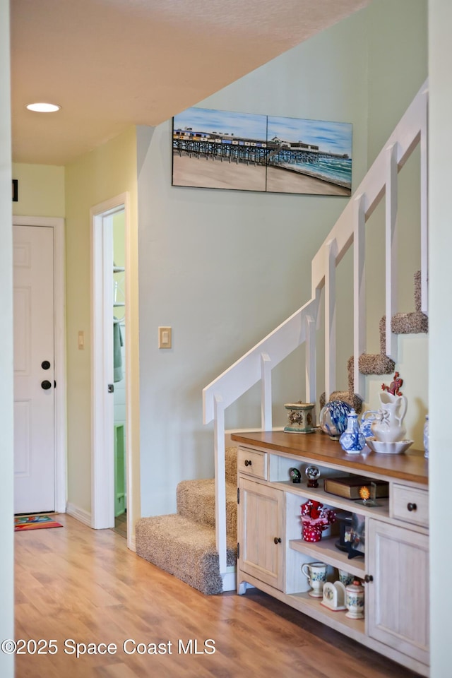 412 Sailfish Ave Unit 16, Cape Canaveral, FL 32920 - staircase featuring wood finished floors