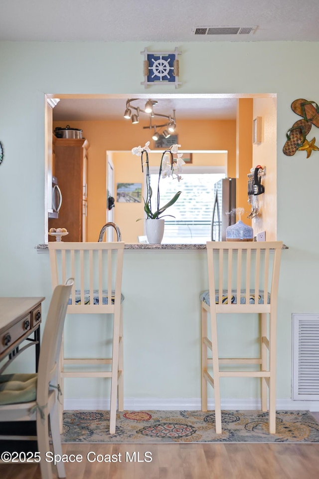 412 Sailfish Ave Unit 16, Cape Canaveral, FL 32920 - kitchen with freestanding refrigerator and baseboards
