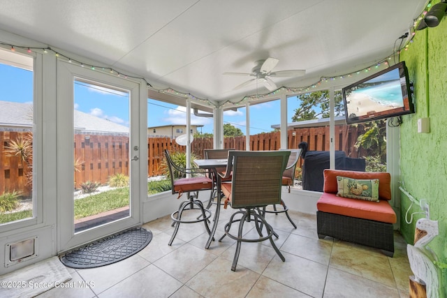 412 Sailfish Ave Unit 16, Cape Canaveral, FL 32920 - sunroom with ceiling fan, healthy amount of natural light, and outdoor dining space