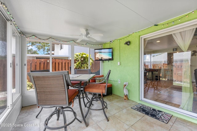 412 Sailfish Ave Unit 16, Cape Canaveral, FL 32920 - sunroom with a ceiling fan and outdoor dining area
