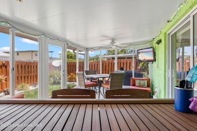 412 Sailfish Ave Unit 16, Cape Canaveral, FL 32920 - sunroom with a ceiling fan and outdoor dining space