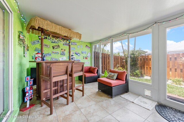 412 Sailfish Ave Unit 16, Cape Canaveral, FL 32920 - sunroom featuring tile patterned floors and healthy amount of natural light