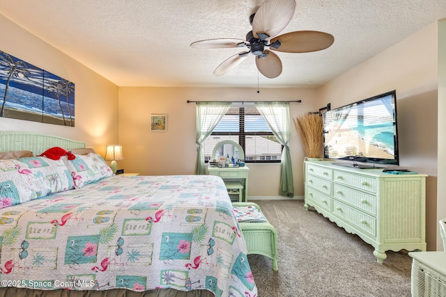 412 Sailfish Ave Unit 16, Cape Canaveral, FL 32920 - bedroom with a textured ceiling, light colored carpet, ceiling fan, and baseboards