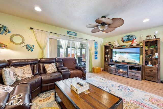 412 Sailfish Ave Unit 16, Cape Canaveral, FL 32920 - living room with light wood finished floors, a ceiling fan, and recessed lighting