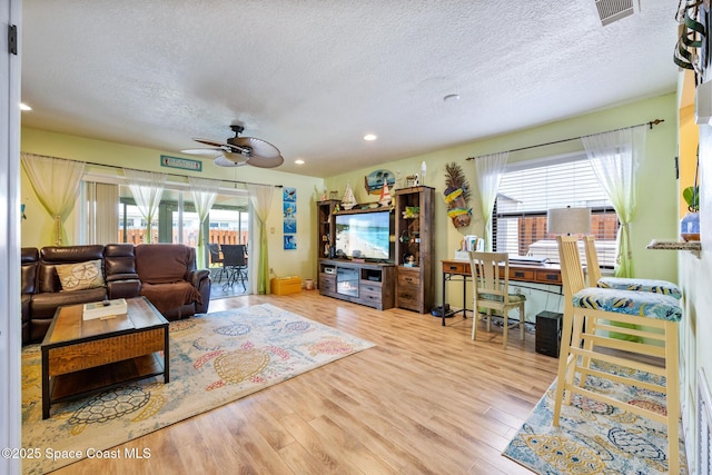 412 Sailfish Ave Unit 16, Cape Canaveral, FL 32920 - living room featuring a textured ceiling, wood finished floors, ceiling fan, and recessed lighting