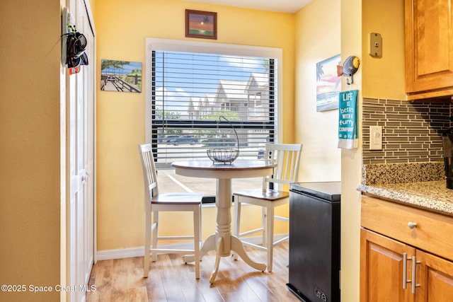 412 Sailfish Ave Unit 16, Cape Canaveral, FL 32920 - dining area featuring light wood-type flooring and baseboards