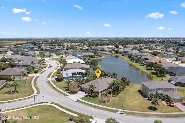 aerial view with a water view and a residential view