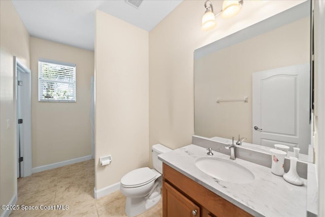 bathroom with toilet, tile patterned floors, visible vents, baseboards, and vanity