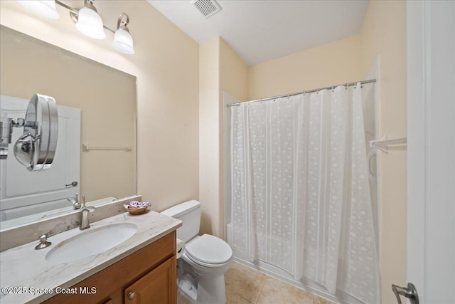 bathroom with shower / tub combo, toilet, visible vents, tile patterned flooring, and vanity