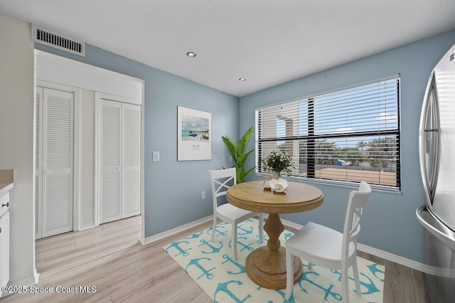 1950 Atlantic St Unit 223, Melbourne Beach, FL 32951 - dining space with baseboards, light wood-style flooring, and recessed lighting