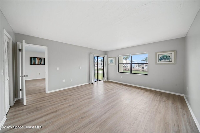 1950 Atlantic St Unit 223, Melbourne Beach, FL 32951 - unfurnished room with light wood-style flooring and baseboards