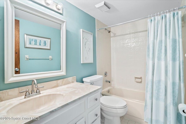1950 Atlantic St Unit 223, Melbourne Beach, FL 32951 - bathroom with toilet, vanity, shower / tub combo with curtain, and tile patterned floors