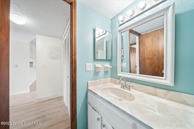 1950 Atlantic St Unit 223, Melbourne Beach, FL 32951 - bathroom with vanity, wood finished floors, and baseboards