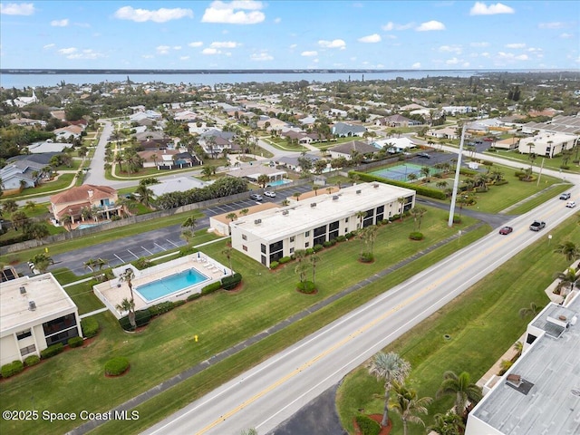 1950 Atlantic St Unit 223, Melbourne Beach, FL 32951 - aerial perspective of suburban area with a pool area and a nearby body of water
