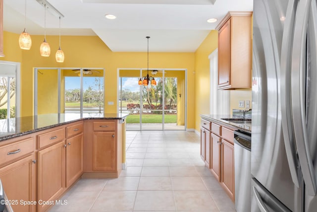 3547 Plume Way, Palm Bay, FL 32909 - kitchen featuring dark stone countertops, recessed lighting, pendant lighting, light tile patterned floors, and appliances with stainless steel finishes
