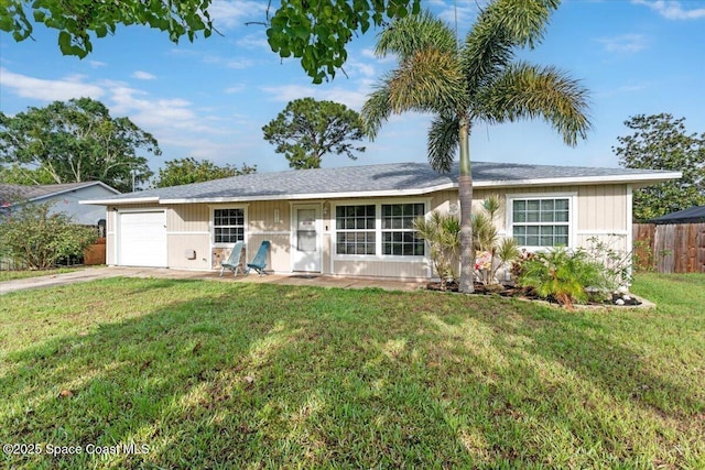 5970 Coker Ave, Cocoa, FL 32927 - ranch-style home with a garage and driveway