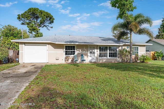5970 Coker Ave, Cocoa, FL 32927 - ranch-style house with an attached garage and driveway
