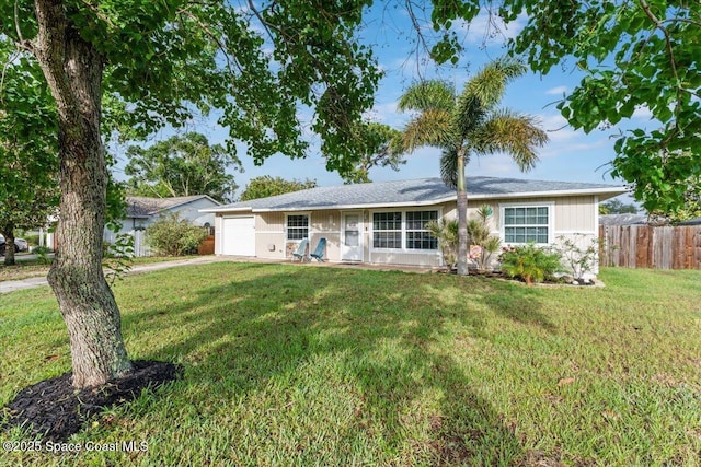 5970 Coker Ave, Cocoa, FL 32927 - single story home with an attached garage and concrete driveway