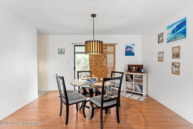 5970 Coker Ave, Cocoa, FL 32927 - dining room with light wood finished floors and baseboards