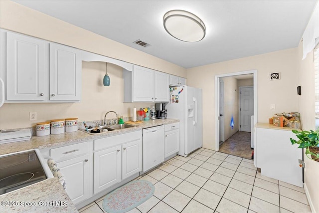 5970 Coker Ave, Cocoa, FL 32927 - kitchen with white appliances, a sink, and white cabinetry