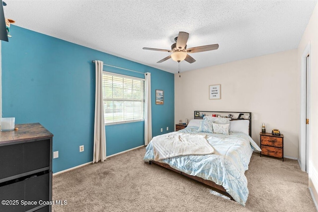 5970 Coker Ave, Cocoa, FL 32927 - bedroom with carpet flooring, a textured ceiling, a ceiling fan, and baseboards