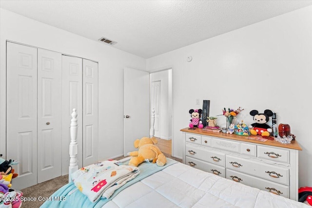 5970 Coker Ave, Cocoa, FL 32927 - carpeted bedroom with a closet and a textured ceiling