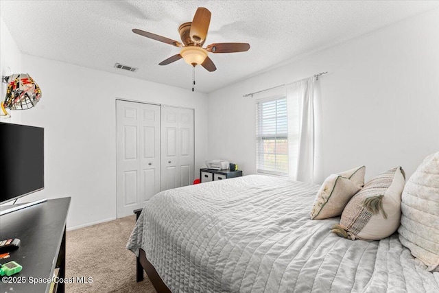 5970 Coker Ave, Cocoa, FL 32927 - carpeted bedroom with a textured ceiling, a closet, and a ceiling fan