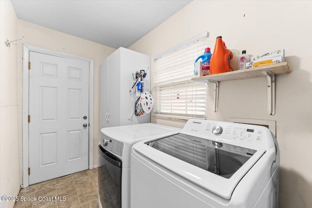 5970 Coker Ave, Cocoa, FL 32927 - washroom featuring washer and clothes dryer and a textured ceiling