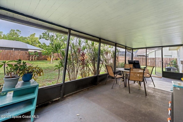 5970 Coker Ave, Cocoa, FL 32927 - sunroom / solarium featuring outdoor dining area